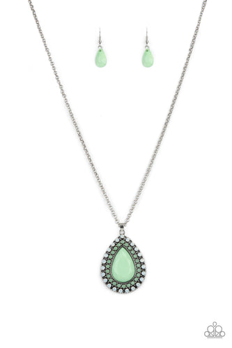 A faceted Green Ash teardrop is pressed into the center of a silver frame bordered in rows of opalescent white and Green Ash beads, creating an ethereal pendant at the bottom of a classic silver chain. Features an adjustable clasp closure