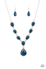 Load image into Gallery viewer, Encased in sleek silver fittings, a chain of faceted blue teardrops gives way to an oversized blue teardrop pendant for an enchanting pop of color below the collar. Features an adjustable clasp closure. 
