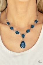 Load image into Gallery viewer, Encased in sleek silver fittings, a chain of faceted blue teardrops gives way to an oversized blue teardrop pendant for an enchanting pop of color below the collar. Features an adjustable clasp closure. 
