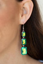 Load image into Gallery viewer, Featuring a dazzling green and gold UV shimmer, a trio of emerald-cut gems in graduating sizes is linked one below the other for a dramatic red carpet finish. Earring attaches to a standard fishhook fitting.
