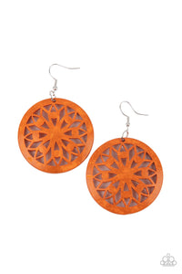 A bold mandala-inspired design is carved out of an oversized orange disc creating an eye-catching statement.  Earring attaches to a standard fishhook fitting.