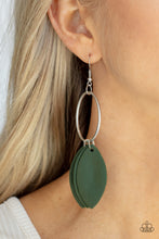 Load image into Gallery viewer, Leafy green leather frames swing from the bottom of a textured silver hoop, creating an earthy fringe. Earring attaches to a standard fishhook fitting. 
