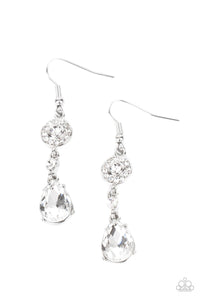 A silver frame dotted in glassy white rhinestones, a solitaire white rhinestone, and an oversized white teardrop gem delicately link into a graceful lure. Earring attaches to a standard fishhook fitting.