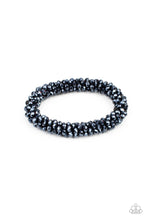 Load image into Gallery viewer, Sparkling with dramatic brilliance, a collection of dainty faceted blue beads are threaded along a woven stretchy band creating a stunning statement around the wrist.
