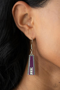 Encased in daintily dotted silver frames, a row of flared silver bars painted in a glossy purple, fans out across the collar. A column of sparkling white rhinestones rises from the bottom of each frame, creating a dramatically deco finish as they sway from a round silver chain. Features an adjustable clasp closure.