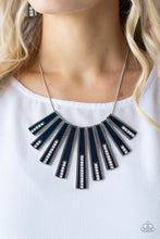 Load image into Gallery viewer, Encased in daintily dotted silver frames, a row of flared silver bars painted in a glossy Navy Blue fans out across the collar. A column of sparkling white rhinestones rises from the bottom of each frame, creating a dramatically deco finish as they sway from a round silver chain. Features an adjustable clasp closure.
