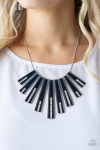 Encased in daintily dotted silver frames, a row of flared silver bars painted in a glossy Navy Blue fans out across the collar. A column of sparkling white rhinestones rises from the bottom of each frame, creating a dramatically deco finish as they sway from a round silver chain. Features an adjustable clasp closure.