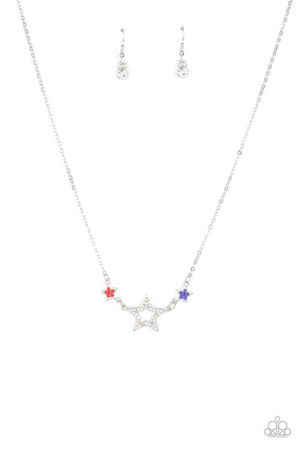 A white rhinestone encrusted silver star is flanked by two dainty blue and red rhinestone encrusted silver stars, creating a sparkly patriotic pendant below the collar. Features an adjustable clasp closure.