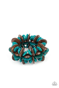 A collection of turquoise and brown disc-shaped wooden beads are threaded along stretchy bands creating a tropical island vibe around the wrist.