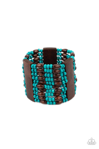 Stacked layers of bright turquoise and brown wooden beads are threaded along stretchy bands and wrap around the wrist in a linear pattern. Three wide wooden bars interrupt the pattern, adding weight to the tropically inspired collection. 