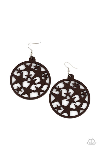 An oversized round brown wooden frame is filled with a cosmos of cut-out brown stars creating a whimsical statement. Earring attaches to a standard fishhook fitting.