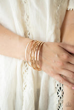 Load image into Gallery viewer, Infused with plain gold bangles, pairs of twisted and faceted gold bracelets stack across the wrist for endless shimmer.  Sold as one set of six bracelets.
