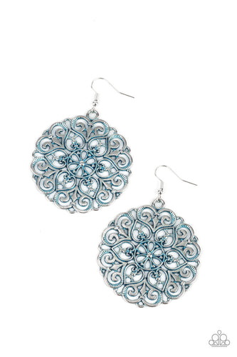 Brushed in a dreamy blue finish, an oversized mandala-like silver frame swings from the ear for a seasonal pop of color. Earring attaches to a standard fishhook fitting.