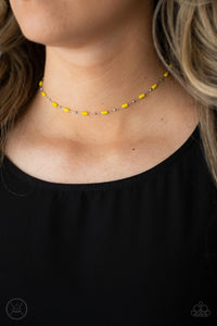 Dainty silver beads and cylindrical Illuminating beads delicately link around the neck, creating a minimalist inspired pop of color. Features an adjustable clasp closure.