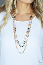 Load image into Gallery viewer, Infused with sections of earthy brown, black, and green stones, a trio of mismatched gold chains layer down the chest for a dash of rustic refinement. Features an adjustable clasp closure.
