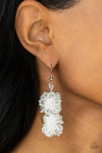 Strands of iridescent seed beads delicately knot into an elegantly clustered lure, creating a stellar modern look. Earring attaches to a standard fishhook fitting.