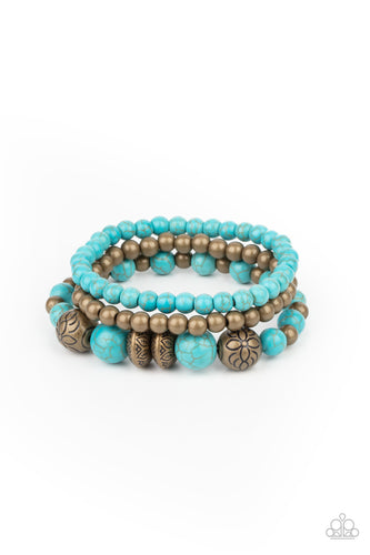 A whimsically mismatched collection of turquoise stone beads, plain brass beads, and antiqued floral accents are threaded along stretchy bands around the wrist, creating colorful layers.  Sold as one set of three bracelets.