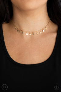 Dainty gold discs swing from a glistening gold chain, creating a shimmery fringe around the neck. Features an adjustable clasp closure.  Sold as one individual choker necklace. Includes one pair of matching earrings.  New Kit Choker