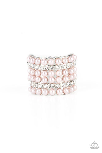 Dainty rows of bubbly pink pearls and glassy white rhinestones alternate across the front of a thick silver band, creating a vintage inspired statement piece. Features a stretchy band for a flexible fit. 