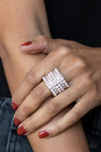 Load image into Gallery viewer, Dainty rows of bubbly pink pearls and glassy white rhinestones alternate across the front of a thick silver band, creating a vintage inspired statement piece. Features a stretchy band for a flexible fit. 
