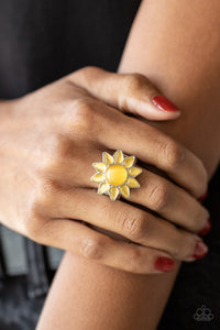 Dainty teardrop yellow cat's eye stones bloom from a round yellow cat's eye stone center, creating a sunny blossom atop the finger. Features a stretchy band for a flexible fit. 