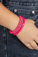 Load image into Gallery viewer, Infused with a strand of round and faceted silver beads, faceted rows of solid and opaque pink cube beads are threaded along stretchy bands, wrapping around the wrist for a vivacious pop of color.
