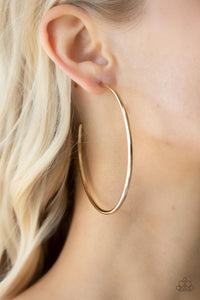 Featuring a high sheen, a polished gold hoop stands out in a mega way creating a trendy display as it wraps around the ear. Earring attaches to a standard post fitting. Hoop measures approximately 3" in diameter. 