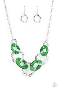 An asymmetrical assortment of Leprechaun acrylic rings and hammered silver hoops boldly interlock below the collar, creating an intense pop of color. Features an adjustable clasp closure.