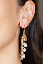 Load image into Gallery viewer, A hammered gold disc, gold chain tassel, and strand of raw cut white rock beads delicately stream from the ear, creating an earthy fringe. Earring attaches to a standard fishhook fitting. 
