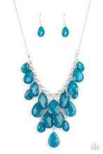 Load image into Gallery viewer, Varying in size, an opaque collection of faceted blue teardrops trickle along a chunky silver chain. Infused with dainty silver chains, additional teardrop beads swing from the effervescent fringe at varying lengths for a glamorous finish. Features an adjustable clasp closure.
