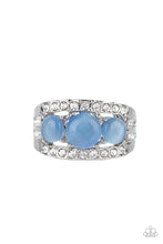 Load image into Gallery viewer, A trio of round Cerulean cat’s eye stones is set in silver pronged fittings between two dainty silver bands that are encrusted in rows of glassy white rhinestones, coalescing into an elegantly layered centerpiece atop the finger. Features a dainty stretchy band for a flexible fit.
