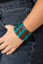 Load image into Gallery viewer, Held together with brown wooden rectangular frames, mismatched rows of oval brown and round blue wooden beads are threaded along stretchy bands around the wrist for a whimsically layered look.  Sold as one individual bracelet.
