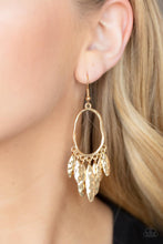 Load image into Gallery viewer, A tapered fringe of hammered gold oval frames swing from the bottom of a hammered oval hoop, creating a musical fringe. Earring attaches to a standard fishhook fitting
