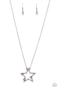 Dotted with glassy white rhinestone centers, a dainty trio of gunmetal stars haphazardly dots the front of a white rhinestone encrusted gunmetal star pendant for a stellar patriotic look. Features an adjustable clasp closure.