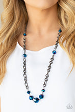 Load image into Gallery viewer, Featuring an oil spill iridescence, faceted metallic blue beads adorn sections of chunky gunmetal chains across the chest for a gritty glamorous fashion. Features an adjustable clasp closure.
