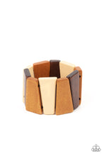 Load image into Gallery viewer, Tinted in various shades of brown, chunky triangular wooden frames are threaded along stretchy bands around the wrist for an earthy look. 
