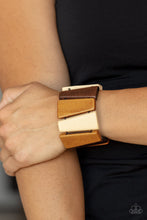 Load image into Gallery viewer, Tinted in various shades of brown, chunky triangular wooden frames are threaded along stretchy bands around the wrist for an earthy look. 
