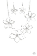 Load image into Gallery viewer, Shiny silver wire delicately twists into oversized blossoms. Varying in size, the airy floral frames delicately link into an asymmetrical display as the layered frames elegantly pop beneath the collar. Features an adjustable clasp closure.
