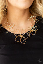 Load image into Gallery viewer, Shiny gold wire delicately twists into oversized blossoms. Varying in size, the airy floral frames delicately link into an asymmetrical display as the layered frames elegantly pop beneath the collar. Features an adjustable clasp closure. 
