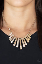 Load image into Gallery viewer, Featuring rustic and shimmery hammered textures, flared gold frames alternate along an invisible wire below the collar, creating an edgy fringe at the bottom of a classic gold chain. Features an adjustable clasp closure.  
