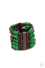 Load image into Gallery viewer, Held together by rectangular wooden frames, rows of brown wooden and distressed Leprechaun discs are threaded along stretchy bands around the wrist for a seasonal pop of color around the wrist.
