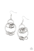 Load image into Gallery viewer, An antiqued collection of dainty silver rings swings from the bottoms of hammered silver hoops that interconnect into an edgy lure. Earring attaches to a standard fishhook fitting.
