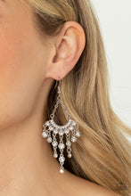 Load image into Gallery viewer, Two rows of sparkly white rhinestones fan out from the bottom of two dainty silver chains. Twinkly tassels of white rhinestones stream out from the bottom of the glimmering frame, creating a timeless chandelier. Earring attaches to a standard fishhook fitting.
