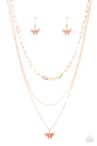 Dotted with a dainty white rhinestone, a decoratively layered shiny copper butterfly swings from the bottom of a display of mismatched shiny copper chains for a whimsically fluttering fashion. Features an adjustable clasp closure. 