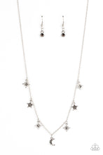 Load image into Gallery viewer, Dotted with dainty hematite rhinestones, a stellar collection of silver moon and star charms swing from a dainty silver chain below the collar, creating a cosmic fringe. Features an adjustable clasp closure.
