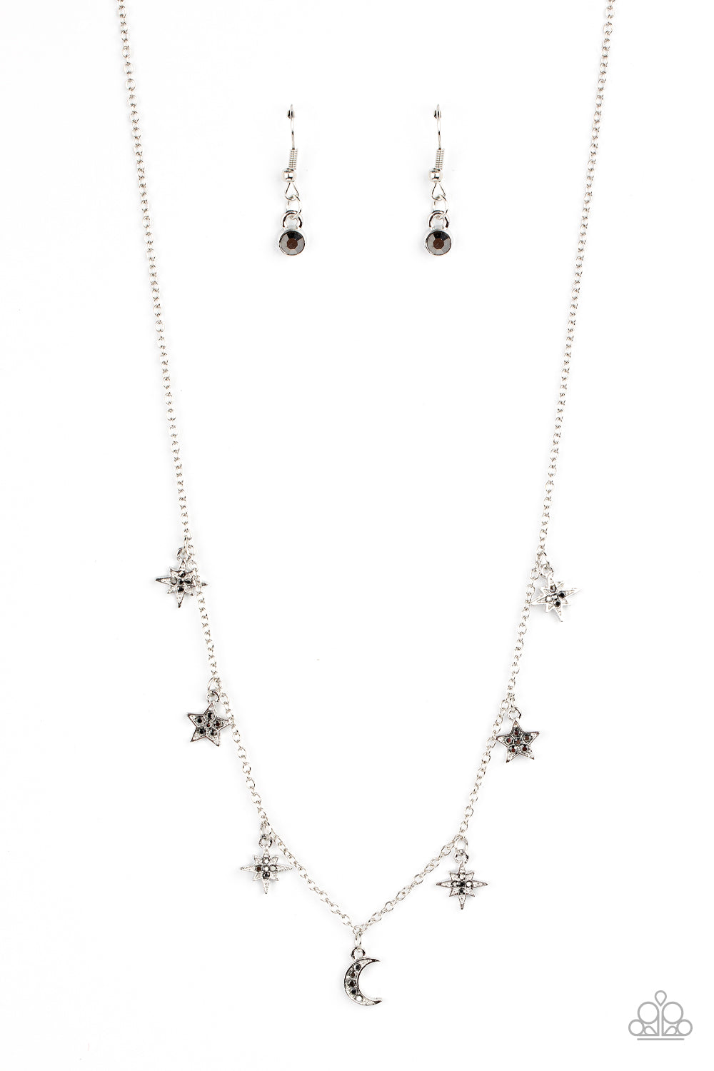 Dotted with dainty hematite rhinestones, a stellar collection of silver moon and star charms swing from a dainty silver chain below the collar, creating a cosmic fringe. Features an adjustable clasp closure.