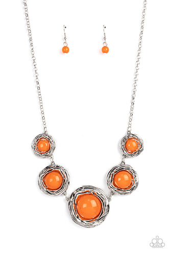Gradually increasing in size, a bubbly collection of oversized glassy orange beads adorn the centers of folds of silver buds below the collar for a seasonal fashion. Features an adjustable clasp closure. 