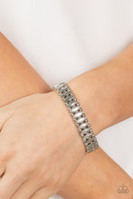 Load image into Gallery viewer, Brushed in an antiqued shimmer, pairs of dainty silver beads flank diamond shaped silver beads along stretchy bands around the wrist for a rustic fashion.
