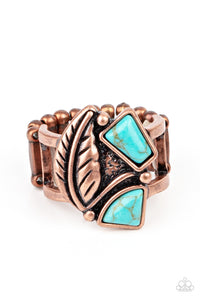 Asymmetrical turquoise stones adorn the front of an antiqued copper frame adorned in a coppery feather, creating a rustic centerpiece atop the finger. Features a stretchy band for a flexible fit.