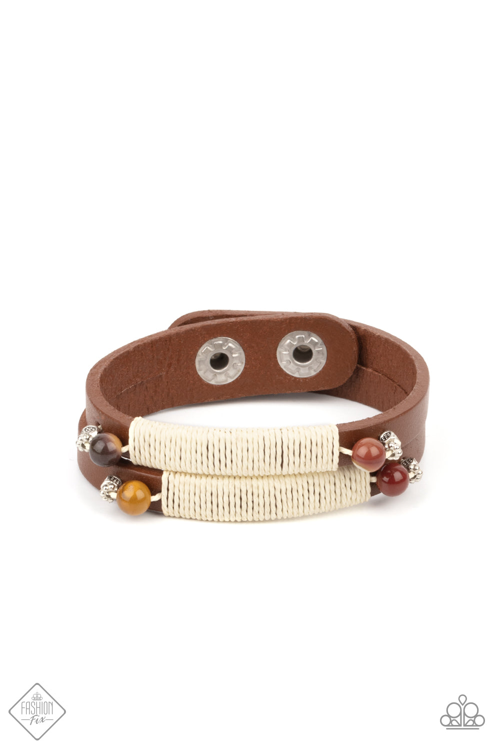 Layered brown leather bands are wrapped with natural creme-colored cording and adorned at each end with an earthy multicolored stone and dainty silver accents, resulting in a rustic homespun finish as it wraps around the wrist. Features an adjustable snap closure.  Sold as one individual bracelet.